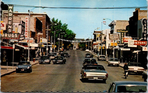 Canada - WEYBURN, SK - Main St / Third St w/signs postcard - CP0449