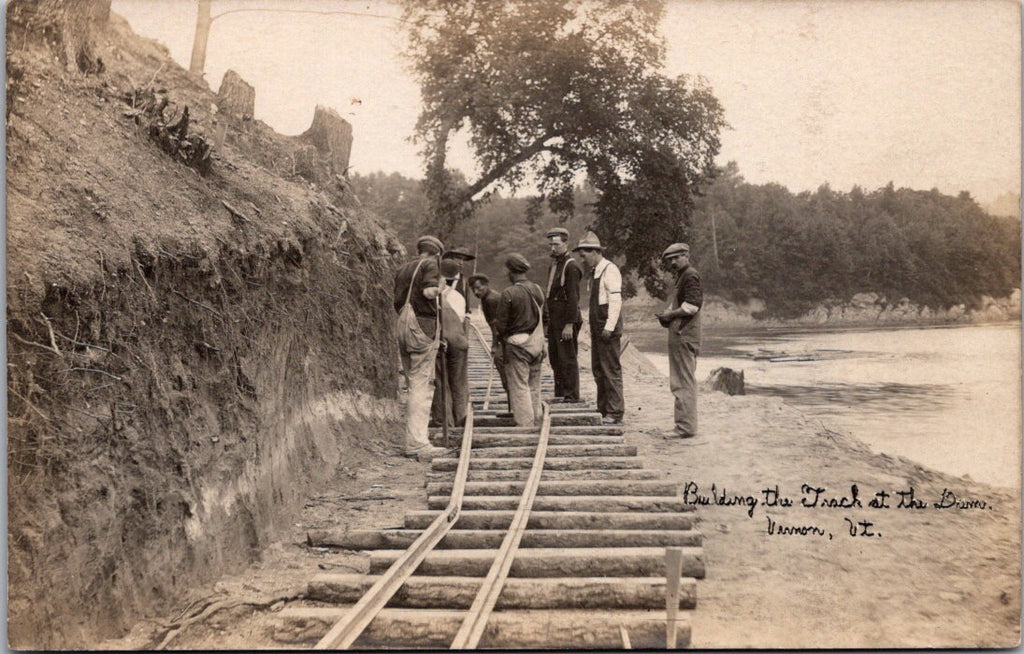 VT, VERNON - Building the track at the dam - workers close up RPPC - D05002