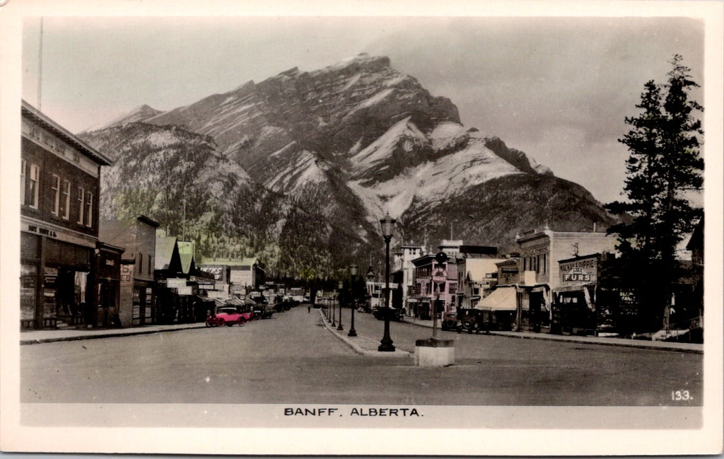 Canada - BANFF, AB - Main St with a lot of signage RPPC - DG0117