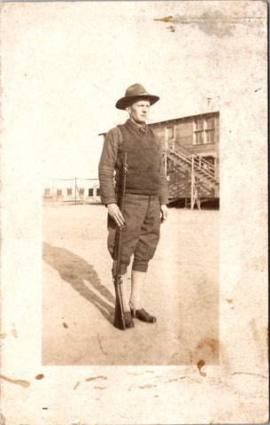 MISC - Military Man in uniform - Gun at side, wearing sweater vest - RPPC - W00416